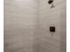 Close-up of shower showcasing sleek tile work and modern fixtures at 220 Mark Twain Ln, Rotonda West, FL 33947