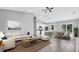 An open-concept area featuring tile floors, fan, modern furnishings and lots of light at 235 Albatross Rd, Rotonda West, FL 33947