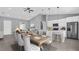 Great room with tile floors, dining table and open access to the kitchen at 235 Albatross Rd, Rotonda West, FL 33947