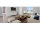 Comfortable living room with tile floors, an L-shaped couch, and a view of the outdoors at 235 Albatross Rd, Rotonda West, FL 33947