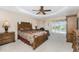 Main bedroom with king-size bed, dresser, and sliding doors to the pool at 240 White Marsh Ln, Rotonda West, FL 33947