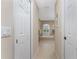 Bathroom with a hallway view of a bathtub and tile flooring at 240 White Marsh Ln, Rotonda West, FL 33947