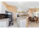 Spacious kitchen with island, stainless steel appliances, and breakfast nook at 240 White Marsh Ln, Rotonda West, FL 33947