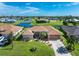 Single-story home with lake view and landscaped yard at 240 White Marsh Ln, Rotonda West, FL 33947