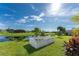 Backyard with a white garden fence and pond view at 240 White Marsh Ln, Rotonda West, FL 33947
