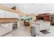 Modern kitchen with white cabinets, granite countertops and breakfast nook at 240 White Marsh Ln, Rotonda West, FL 33947