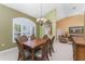Formal dining room with a view into the living room at 240 White Marsh Ln, Rotonda West, FL 33947