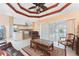 Comfortable living room with access to the pool and kitchen at 240 White Marsh Ln, Rotonda West, FL 33947
