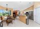 Open concept kitchen with island, stainless steel appliances, and views to living room at 240 White Marsh Ln, Rotonda West, FL 33947