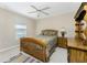 Bedroom with a dresser, bed, and ceiling fan at 240 White Marsh Ln, Rotonda West, FL 33947