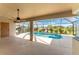 Inviting screened pool area with covered patio at 240 White Marsh Ln, Rotonda West, FL 33947