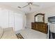 Bedroom with a dresser, closet, and ceiling fan at 240 White Marsh Ln, Rotonda West, FL 33947