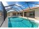 Sparkling pool with a screened enclosure at 240 White Marsh Ln, Rotonda West, FL 33947