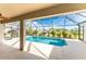 Inviting screened pool area with covered patio at 240 White Marsh Ln, Rotonda West, FL 33947