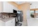 Bright kitchen featuring stainless steel appliances and ample cabinetry at 240 White Marsh Ln, Rotonda West, FL 33947