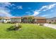 Single story home with landscaped yard and fountain at 240 White Marsh Ln, Rotonda West, FL 33947