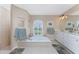 Large bathroom with double vanity, garden tub, and walk-in shower at 240 White Marsh Ln, Rotonda West, FL 33947