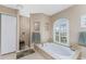 Bathroom with a large garden tub and walk-in shower at 240 White Marsh Ln, Rotonda West, FL 33947