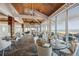 Elegant dining room with ocean views and modern light fixtures at 5000 Gasparilla Rd # Bc201, Boca Grande, FL 33921