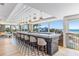 Modern bar with ocean views, stylish barstools, and a sleek design at 5000 Gasparilla Rd # Bc201, Boca Grande, FL 33921