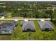 Aerial view showcasing the home's neighborhood and surrounding area at 14194 Wenzel Ave, Port Charlotte, FL 33981