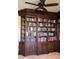 Built-in wooden bookshelves in a home library at 2517 Rio Grande Dr, Punta Gorda, FL 33950