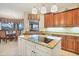 Island kitchen with granite countertops and stainless steel appliances at 2517 Rio Grande Dr, Punta Gorda, FL 33950
