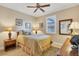 Cozy bedroom with a queen-size bed and ample natural light at 2517 Rio Grande Dr, Punta Gorda, FL 33950