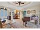 Grand living area featuring a piano and views into the dining room at 2517 Rio Grande Dr, Punta Gorda, FL 33950
