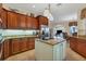 Spacious kitchen with granite countertops, an island, and ample wood cabinetry at 2517 Rio Grande Dr, Punta Gorda, FL 33950