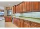 Modern kitchen featuring wood cabinets, granite countertops and stainless steel appliances at 2517 Rio Grande Dr, Punta Gorda, FL 33950