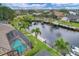 Aerial view of canal-front property with pool and private dock at 2517 Rio Grande Dr, Punta Gorda, FL 33950