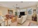 Relaxing living room with leather and cream sofas and a large TV at 2517 Rio Grande Dr, Punta Gorda, FL 33950