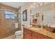 Updated bathroom with granite vanity, shower, and window at 2517 Rio Grande Dr, Punta Gorda, FL 33950