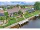 Resort-style backyard oasis with pool, dock, and lush landscaping at 2517 Rio Grande Dr, Punta Gorda, FL 33950