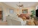 Comfortable living room with leather sofas and a view to the kitchen at 2517 Rio Grande Dr, Punta Gorda, FL 33950