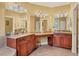 Double vanity bathroom with granite countertops and large mirrors at 2517 Rio Grande Dr, Punta Gorda, FL 33950