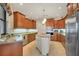 Large kitchen with an island, stainless steel appliances, and granite countertops at 2517 Rio Grande Dr, Punta Gorda, FL 33950