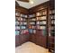 Extensive built-in bookshelves fill this home library at 2517 Rio Grande Dr, Punta Gorda, FL 33950