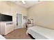 Twin bedroom with a TV and access to bathroom at 3195 Village Ln, Port Charlotte, FL 33953