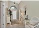 Bright and airy entryway with tiled floors and a stylish console table at 3195 Village Ln, Port Charlotte, FL 33953