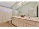 Bathroom with double vanity and shower/tub combo at 3195 Village Ln, Port Charlotte, FL 33953