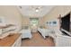 Twin bedroom with a TV and built-in dresser at 3195 Village Ln, Port Charlotte, FL 33953