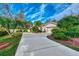 Single-story home with a well-manicured front yard and driveway at 3195 Village Ln, Port Charlotte, FL 33953