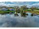 Aerial view of a house on the lake at 3195 Village Ln, Port Charlotte, FL 33953