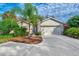 Well maintained house exterior with a two car garage at 3195 Village Ln, Port Charlotte, FL 33953