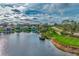 Aerial view of lakefront property and golf course at 3195 Village Ln, Port Charlotte, FL 33953