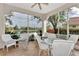 Spacious screened porch overlooking a peaceful lake at 3195 Village Ln, Port Charlotte, FL 33953