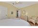 Bright bedroom with a comfortable sitting area and ample closet space at 3195 Village Ln, Port Charlotte, FL 33953