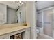 Vanity with a large mirror and shower at 3195 Village Ln, Port Charlotte, FL 33953